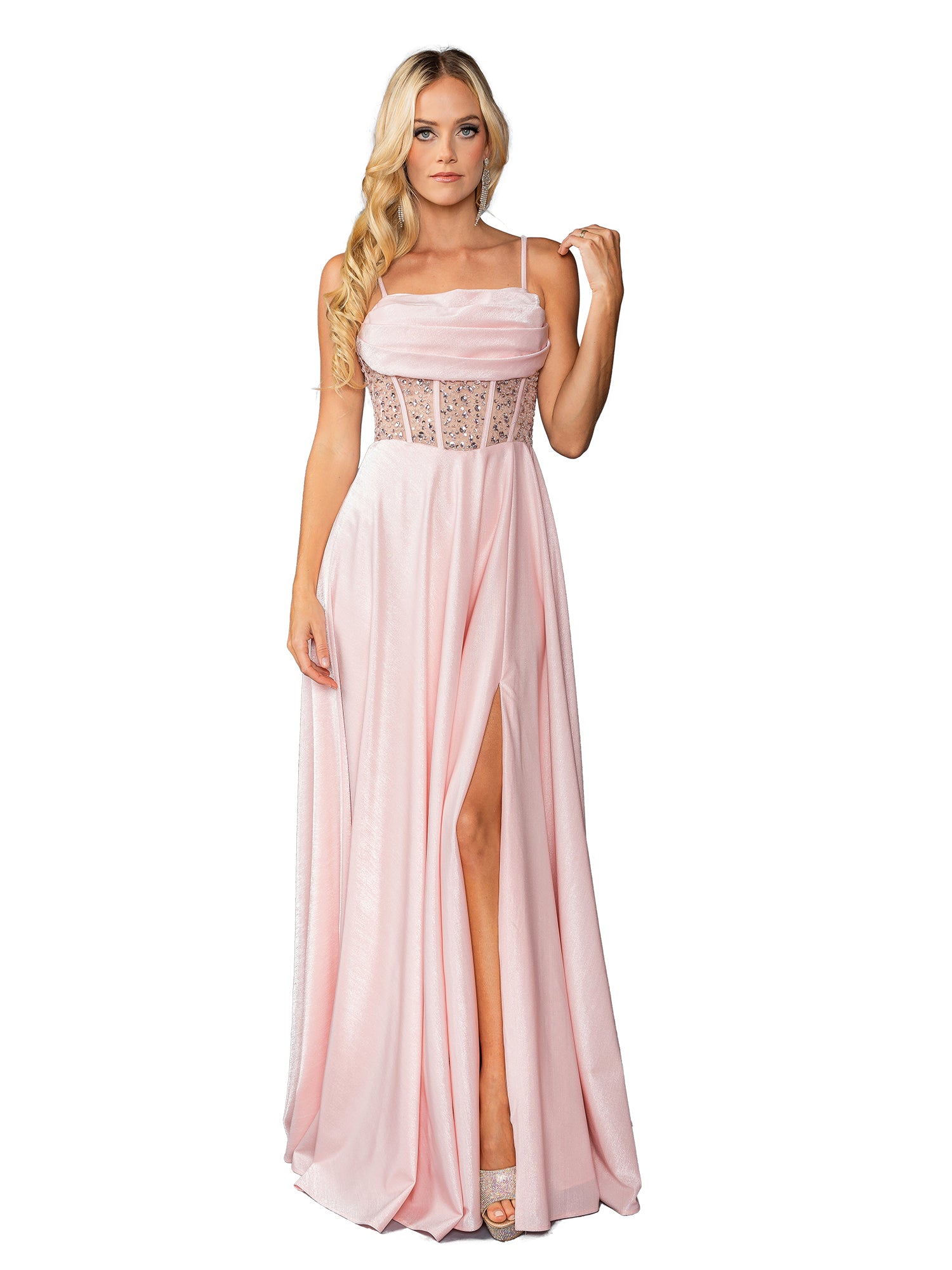 A woman poses against a white background in the Long Blush Pink Prom Dress: Dancing Queen 4463, featuring thin straps, a sheer corset bodice, high slit, and an elegant A-line silhouetteโperfect for formal occasions.